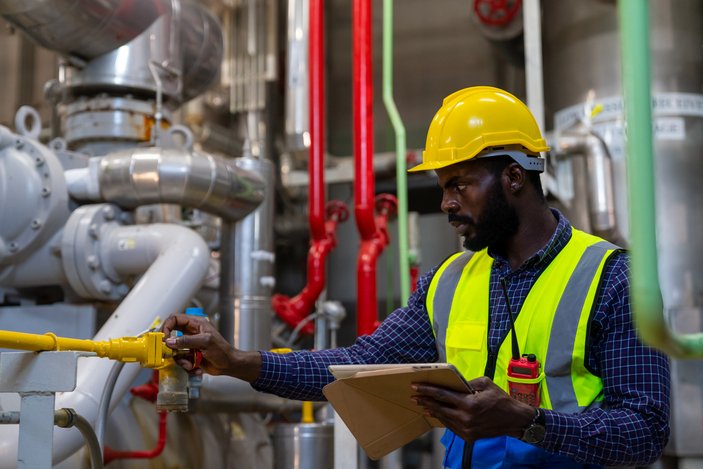 NLNG Recruitment - male engineer doing paperwork