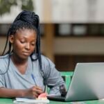 2025 Nigerian Immigration Exam candidate writing